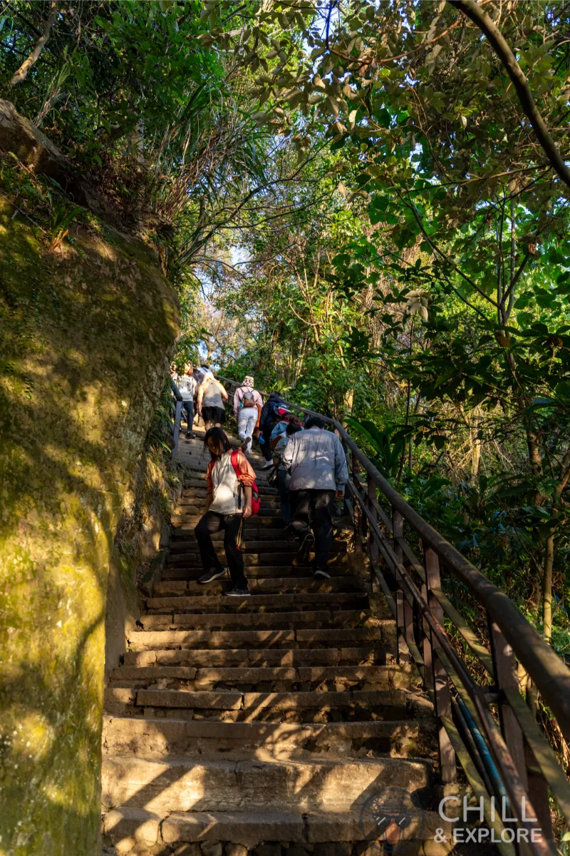 people walking up stairs to Mt Xiangshan