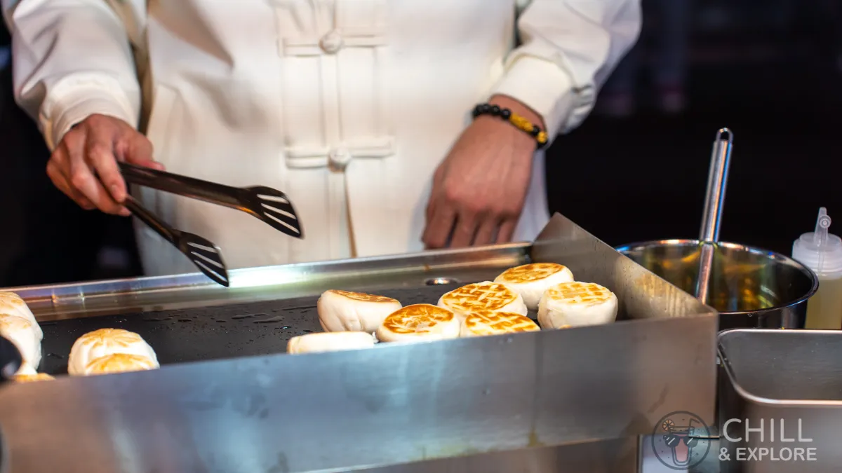 steamed baos being fried